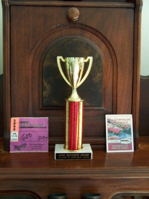 Participation sticker, club travel trophy, and Carlisle mini-plack.